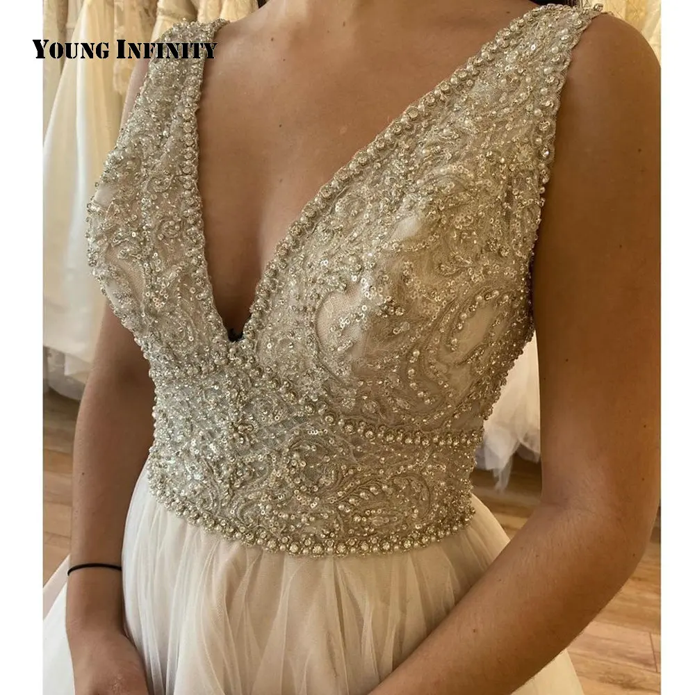 Beautiful Floor Length White Prom Dress Tulle V Neck Sleeveless Backless Beading Sequined Sweep Train Ball Gown Party Gown 2021