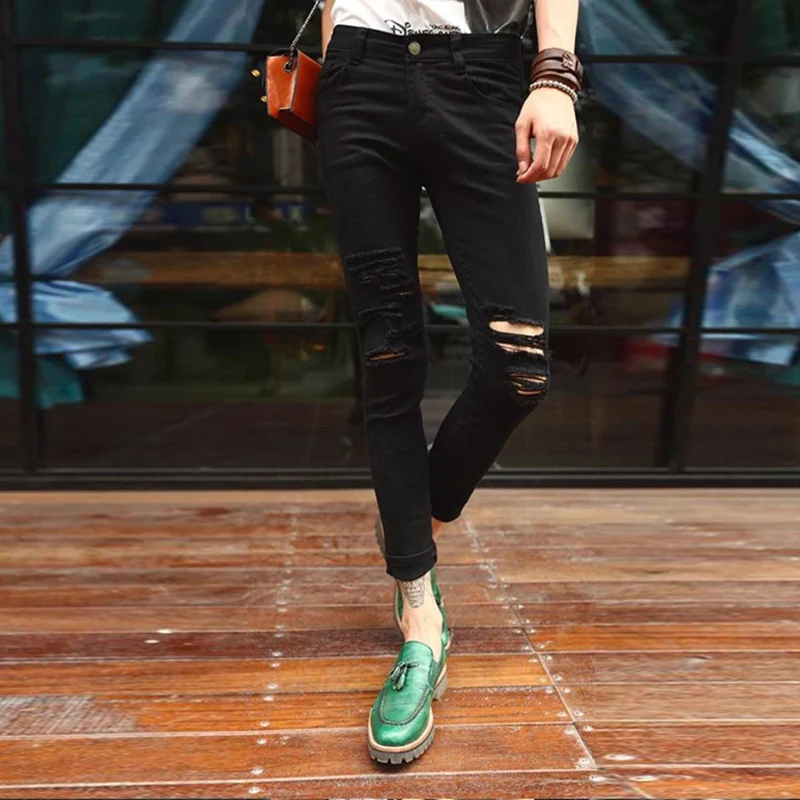 Мужские джинсы с вырезами на коленях черные в европейском и американском стиле