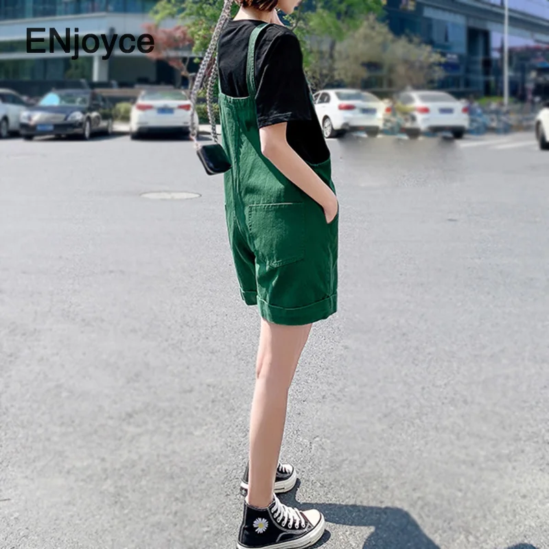 Женский джинсовый комбинезон повседневный зеленый на бретельках с большими