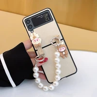for samsung galaxy z flip 5g 4g 3 flip3 fashion portable pearl bracelet hand chain cartoon girl carrying gold leather case cover
