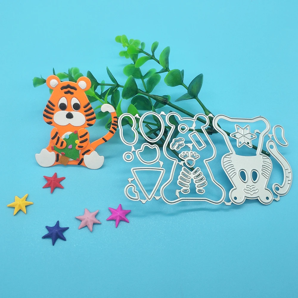 

Tiger cutting template holding Christmas tree for metal cutting of DIY scrapbook, used for card making, embossing crafts