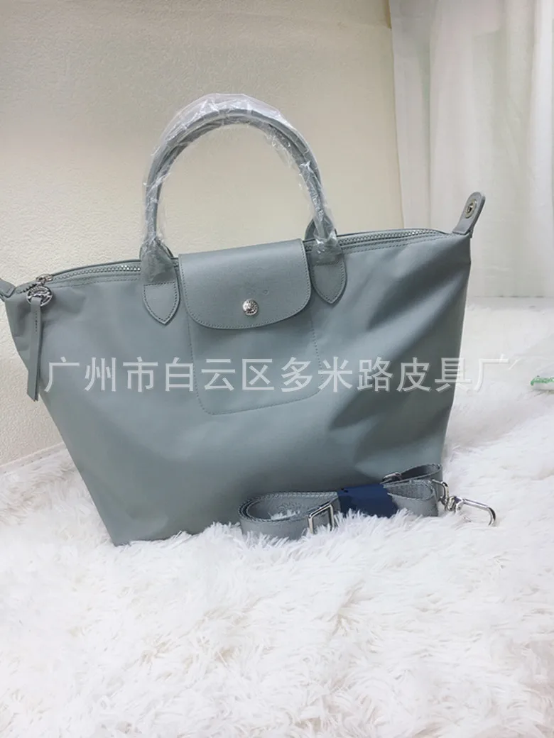 

Cowhide thickened Longxiang dumpling bag, shoulder messenger nylon bag, large capacity