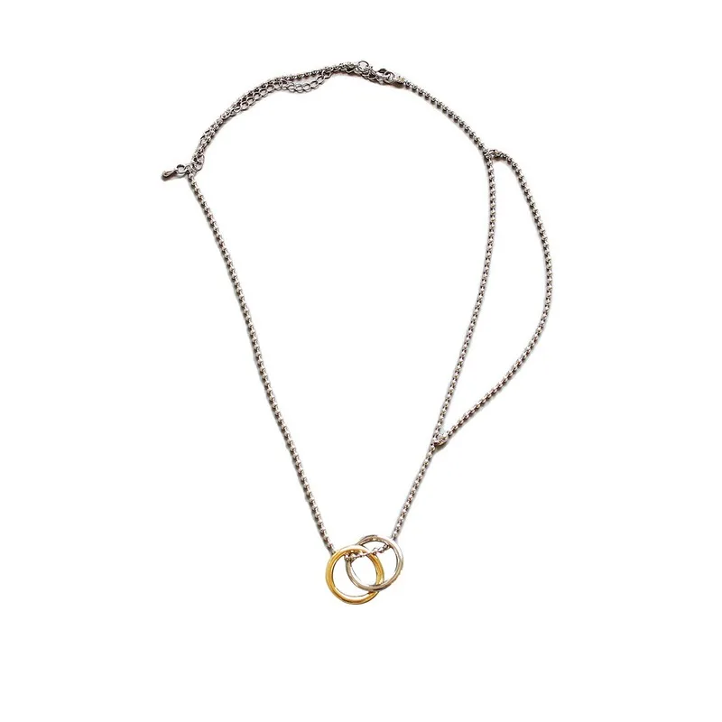 

Simple multi-layered two-color doughnome necklace