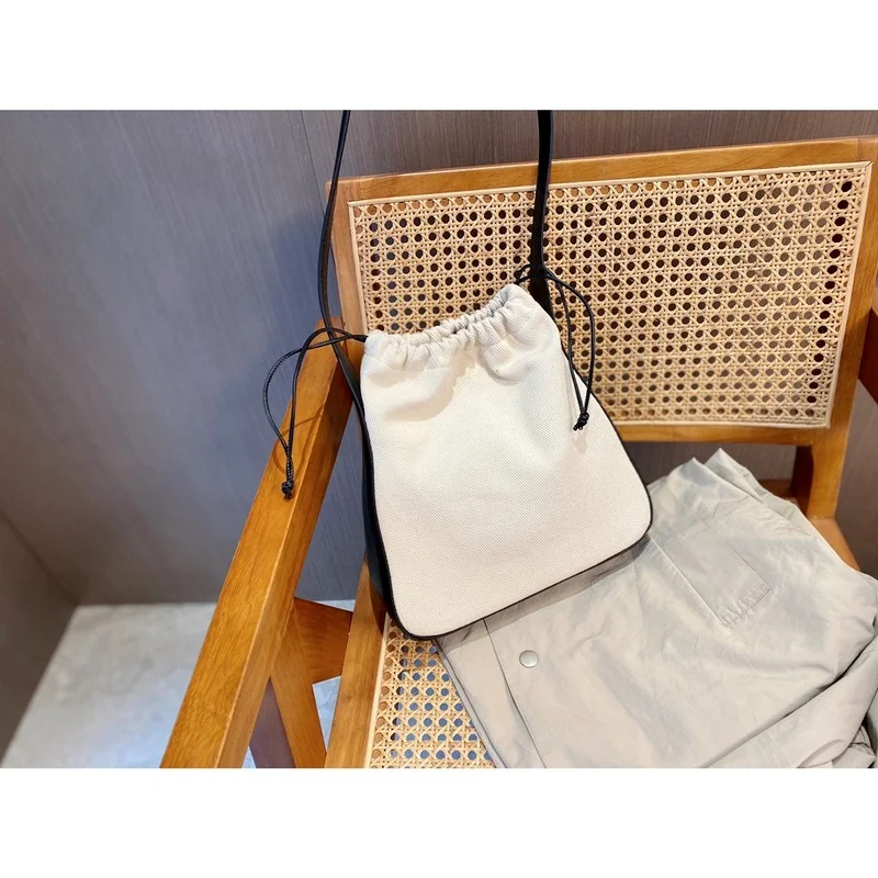 110986 Designer Luxury Fashion Classic Luxury Drawstring Canvas Bag Stitched Leather Underarm Bag One Shoulder Handbag A2