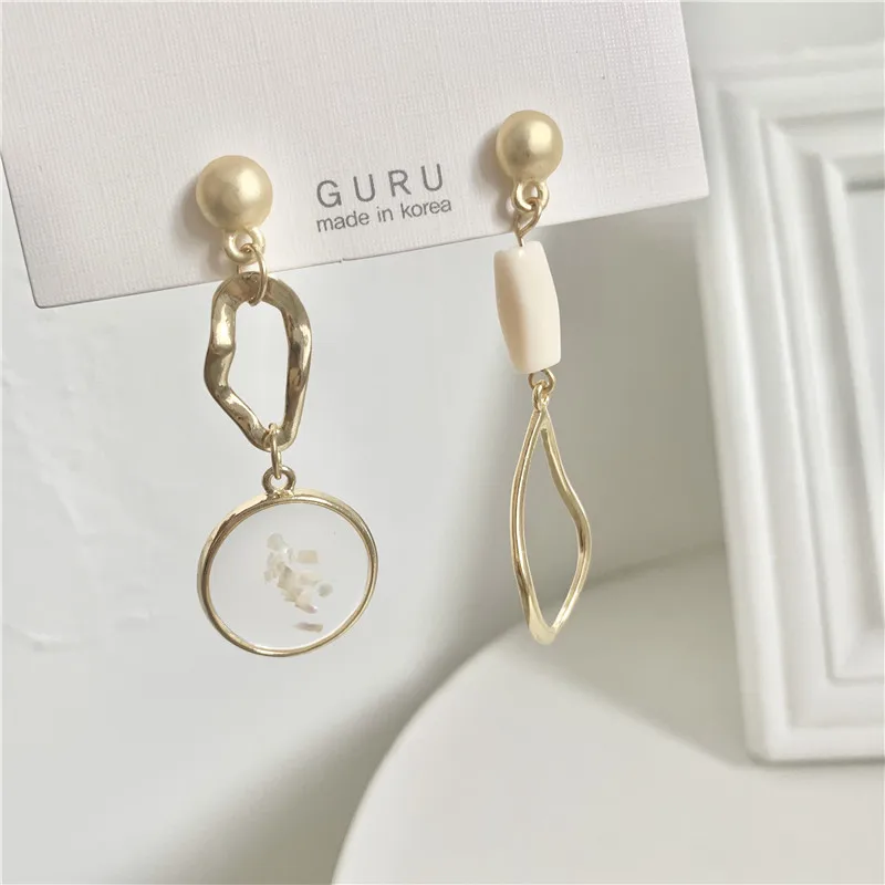 Женские асимметричные серьги клипсы золотого цвета круглые овальные без