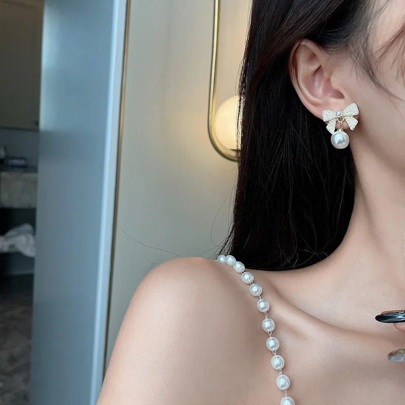 Милые серьги для девушек тонкие жемчужные с бантом модные новые темпераментные в