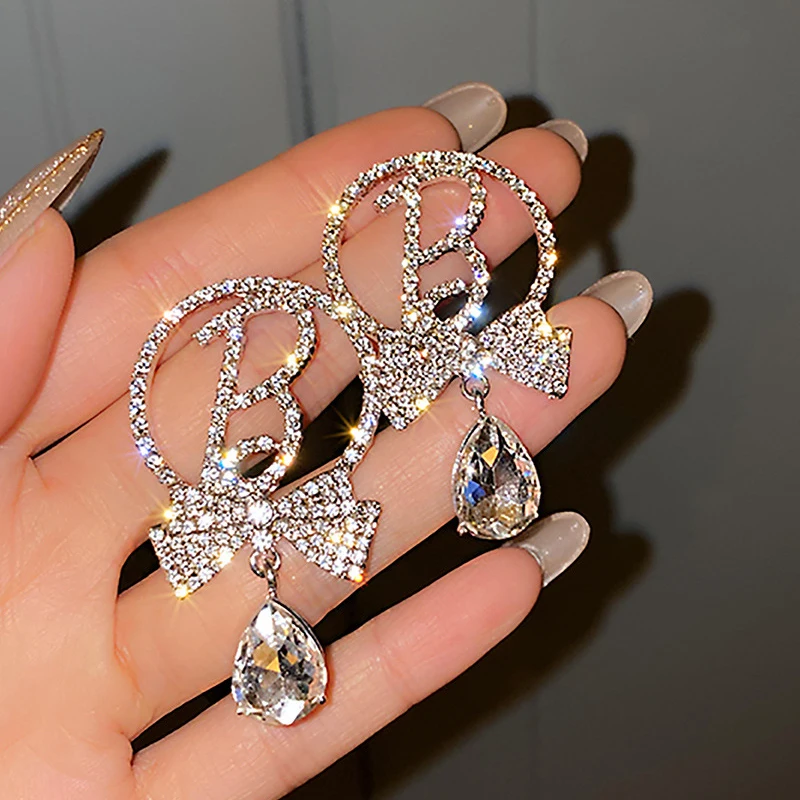 

Trendy Elegant 14K Real Gold Plated Letter Bowknot Earrings for Women Top AAA Shiny Zircon S925 Silver Needle Stud Jewelry Gift