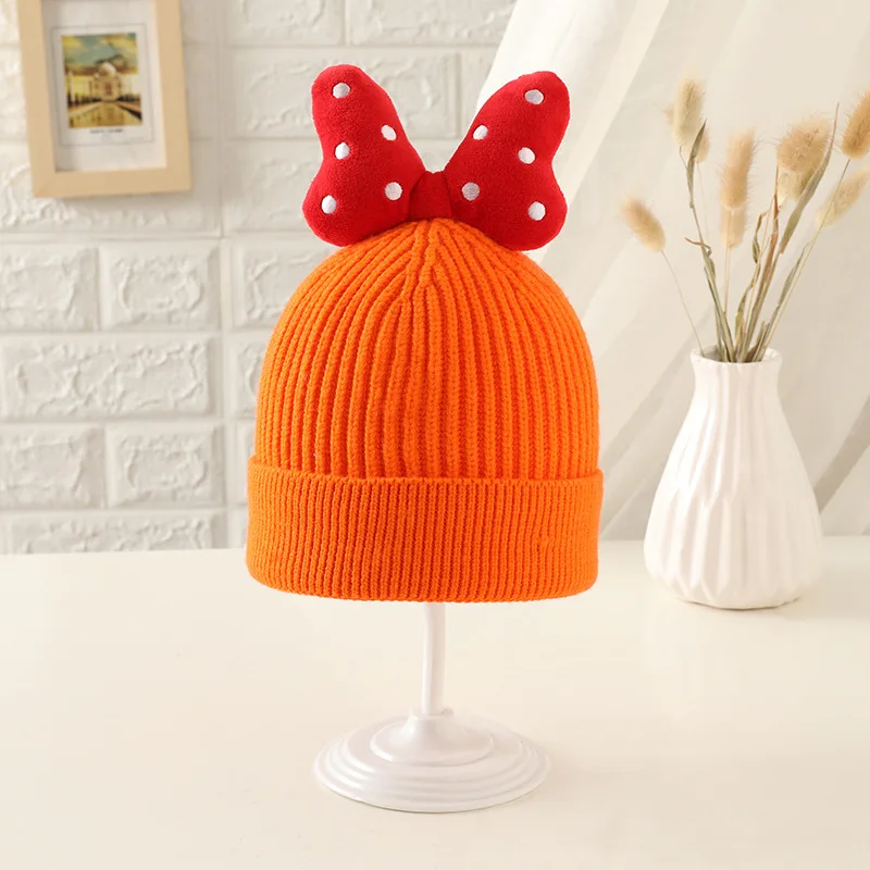 

Korean version of autumn and winter new children's solid-color knitted wool hat large bow curled girl baby warm head cap