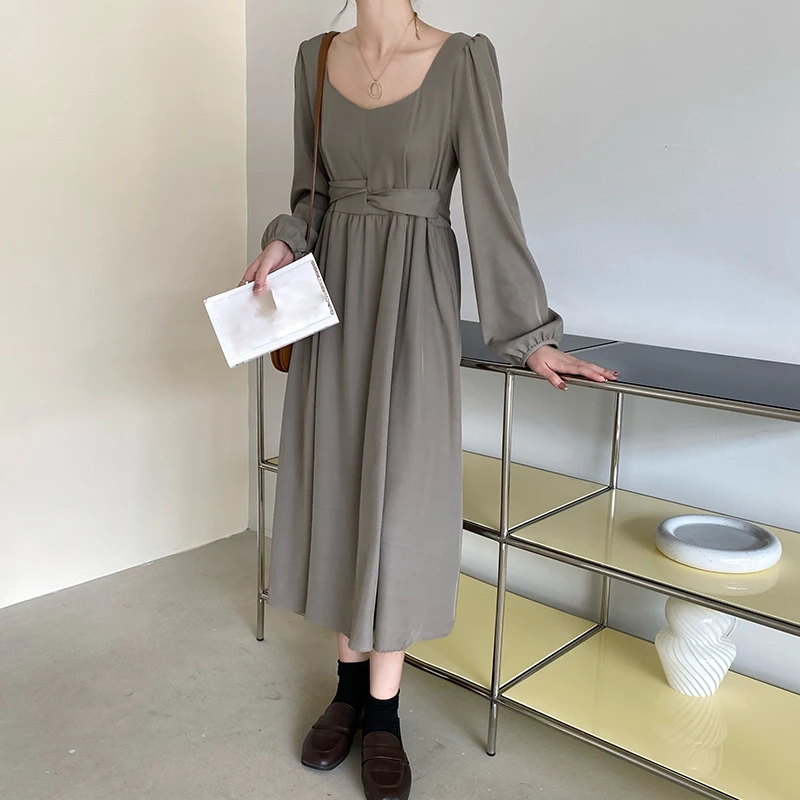 

Large size women's design sense waist cross strap V-neck long sleeve dress 2022 spring autumn new slim joker solid color skirt