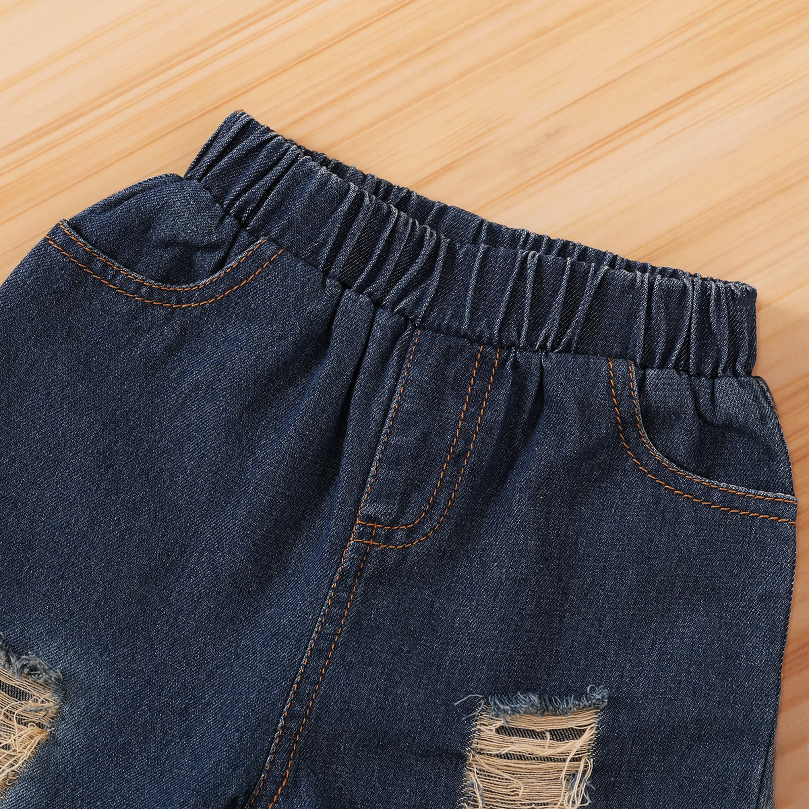 

Spring and autumn children's clothing Three Piece Solid Round Neck Flared Sleeve Top + Ripped Jeans