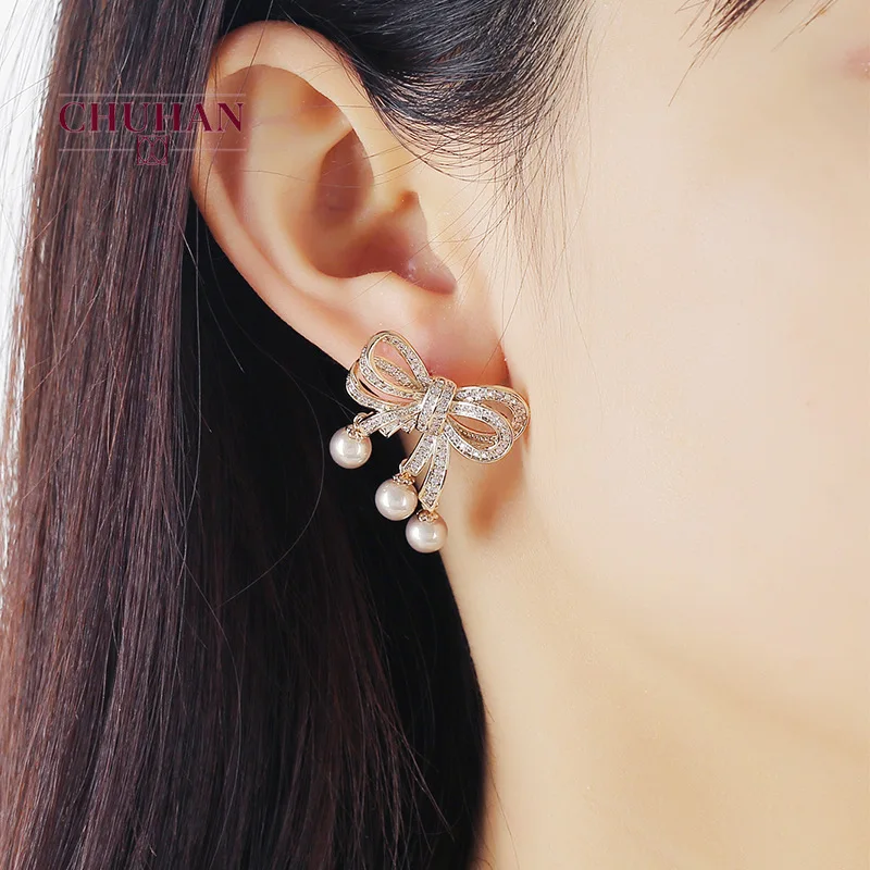 Женские серьги-гвоздики в виде банта золотого и серебряного цвета | Украшения