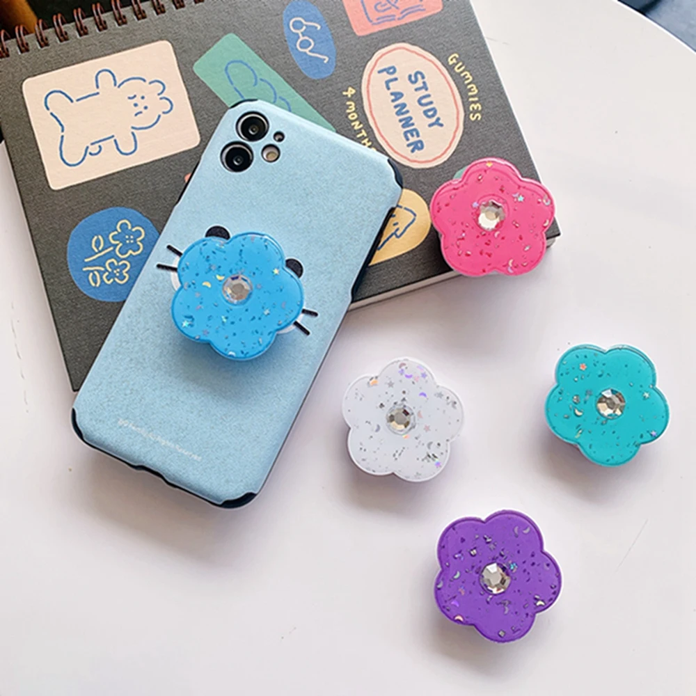 

The new flash diamond flower mobile phone holder with foldable ring and universal glue, suitable for iPhone, Samsung, Xiaomi, Re