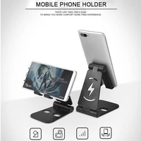 universal folding desktop stand for cell phone tablet pad with non slip silicone pad and charging location reserved line hole