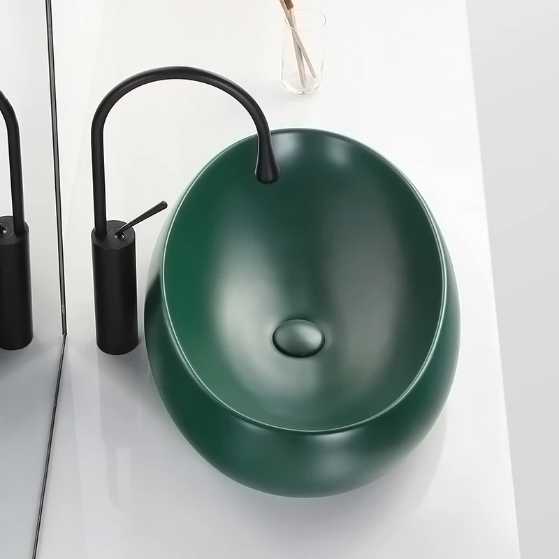 

Modern dark green black matte above counter basin oval bathroom washbasin household wash basin ceramic washbasin