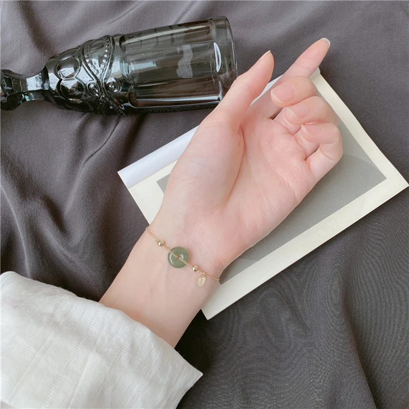 

LISM 925 Sterling Silver Round Hetian Jade Bracelet Temperament Pulling Design Sense Light Luxury Retro Female Bracelet 2020