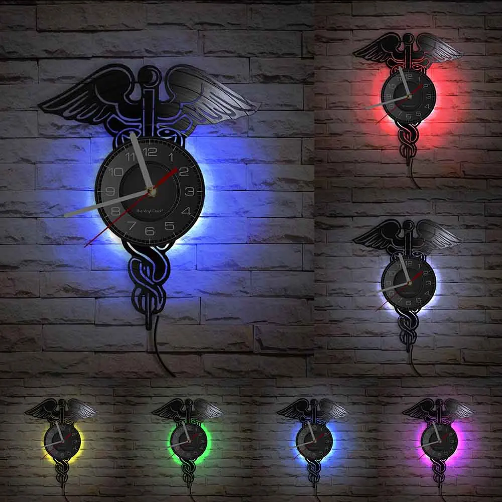 Часы настенные виниловые с изображением крыльев змеи и пластинки в медицинской