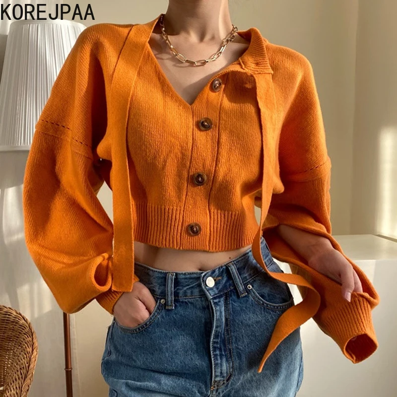 

Женский трикотажный пуловер с пышными рукавами, V-образным вырезом и пуговицами