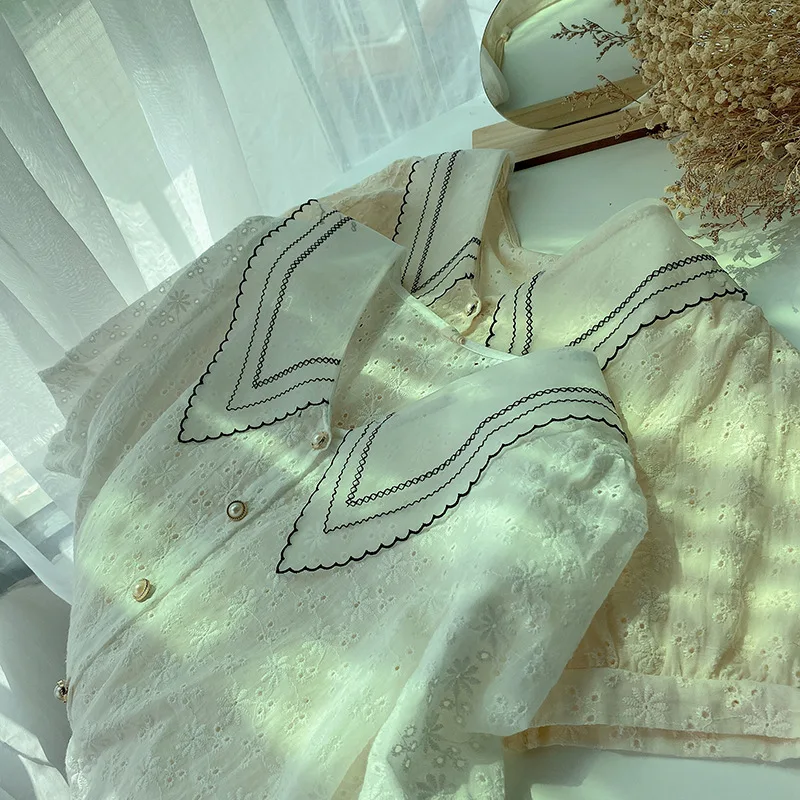 

Summer new pointed V-neck short-sleeved shirt single-breasted crochet hollow fashion temperament top women