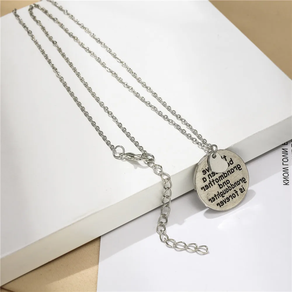 

100pcs / lot hot selling European and American jewelry fashion accessories family letter Necklace Fashion Pendant Necklace Gift