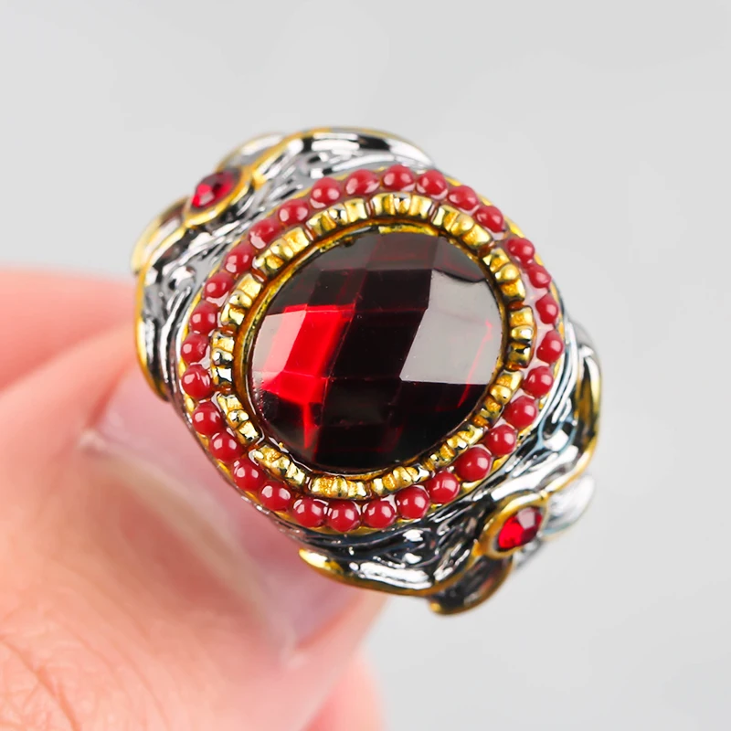 Винтажное двухцветное кольцо с большим овальным красным камнем и бантом для