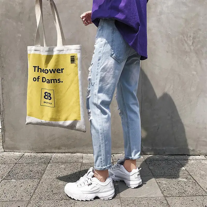 Super-hot oversized ripped jeans men's broken copper loose-fitting beggar South Korea scraped ninth pants pencil jeans for men