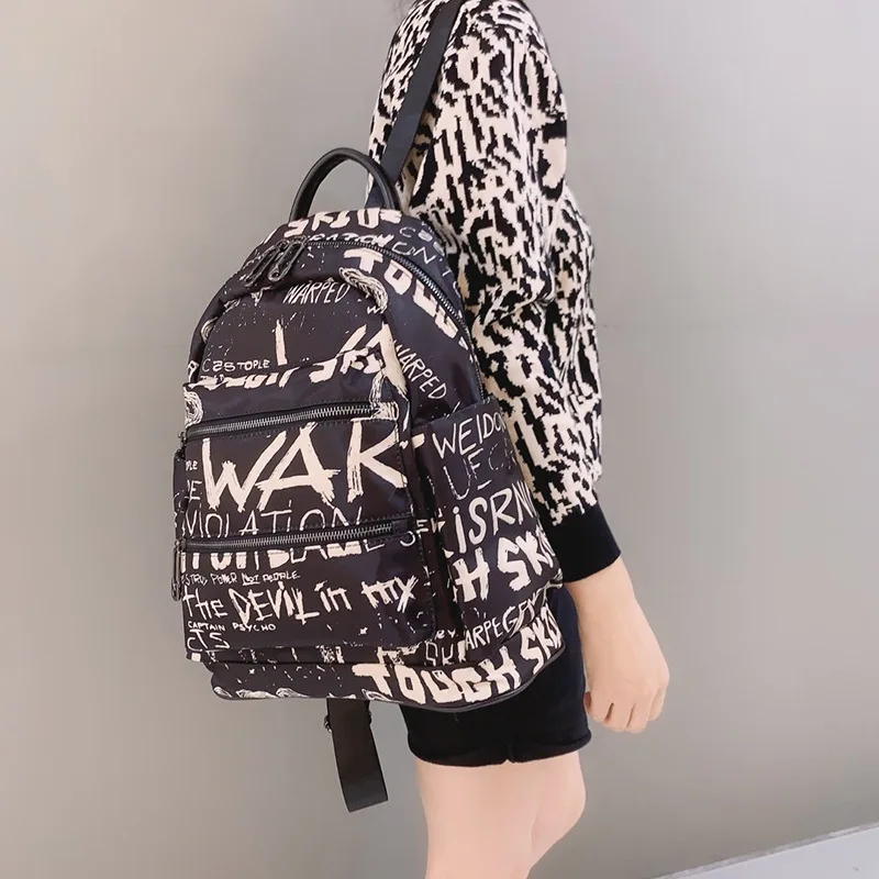 

The new INS fashion backpack casual large capacity fashion Oxford cloth with leather letters backpack