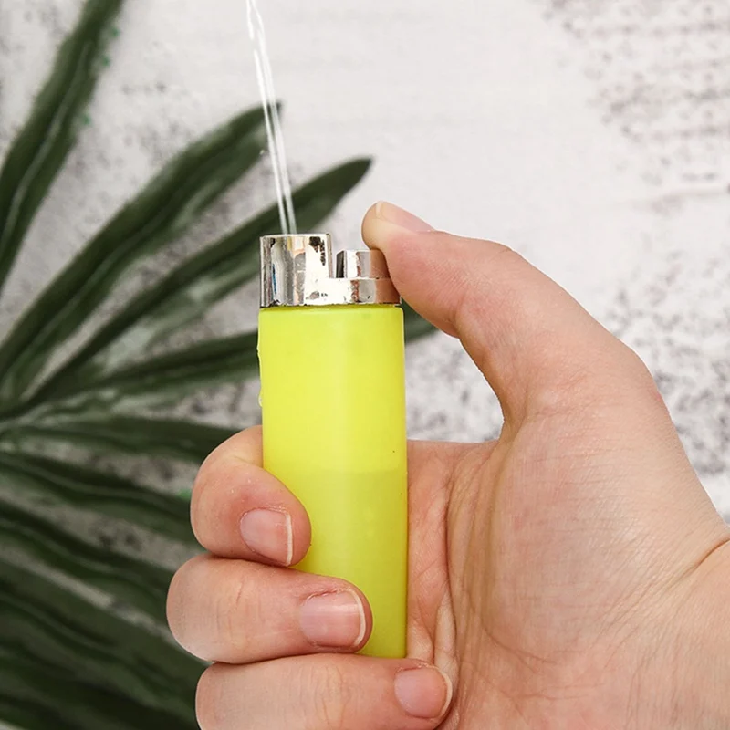 

Funny Toy Teasing Friends Joke Prank Fake Lighter Water Squirting Lighter Prank Props More Happy In Party Random Color