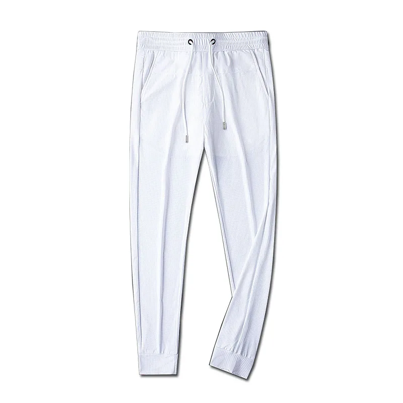 

Quality woven white sports pants men's summer thin simple closed pants men's knitted pants