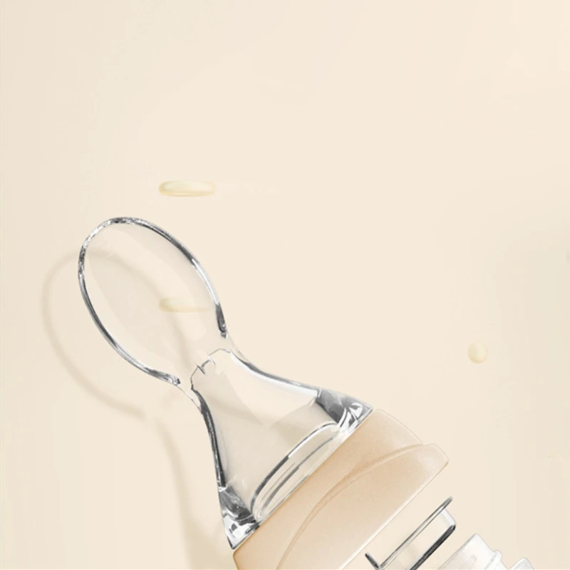 

Baby Feeding Bottle Silicone Squeeze Tableware Spoon Milk Cereal Training Feeder 54DA