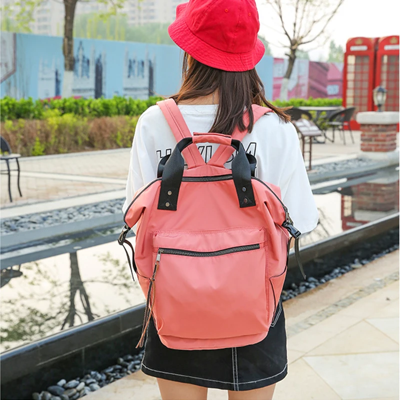 

Women's nylon raincoat backpack, large capacity schoolbag, leisure travel bag, laptop bag.