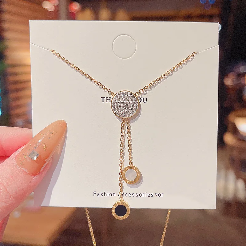 

Titanium steel electroplating black and white double round tassel Roman pendant necklace full of diamonds round clavicle chain