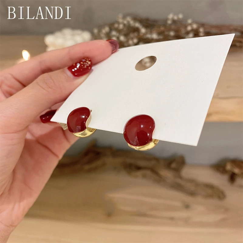 

Bilandi Women Jewelry Sweet Earrings Popular Design Elegant Temperament Golden Plating Red Stud Earrings For Girl Lady Gifts