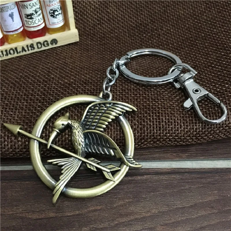 

New Fashion Hunger Games Keychains Logo Mockingbird Stereo Key Chain Alloy Metal Key Ring Pendant Key Rings