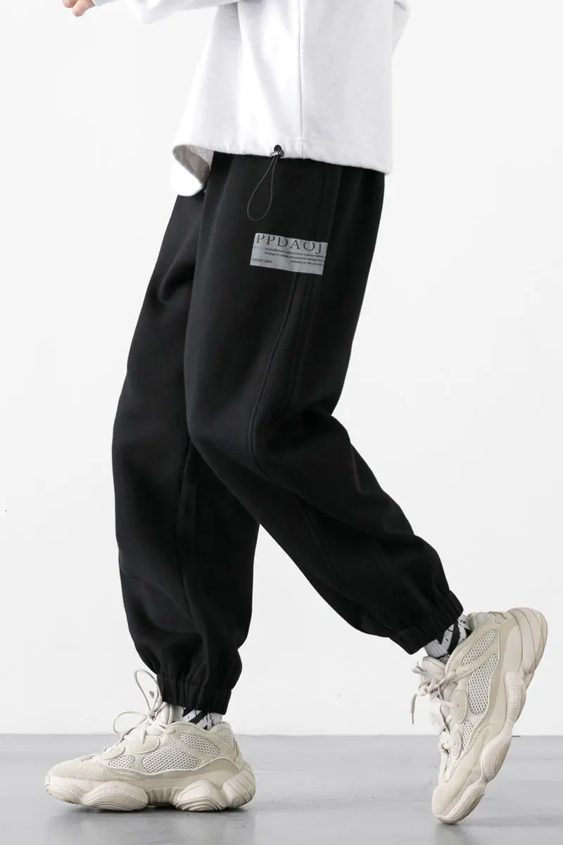 

Winter 2020 Men's New Solid Color Reflective Lettered Print Oversized Foot Binding Plush Loose Casual Sports Pants M-5XL
