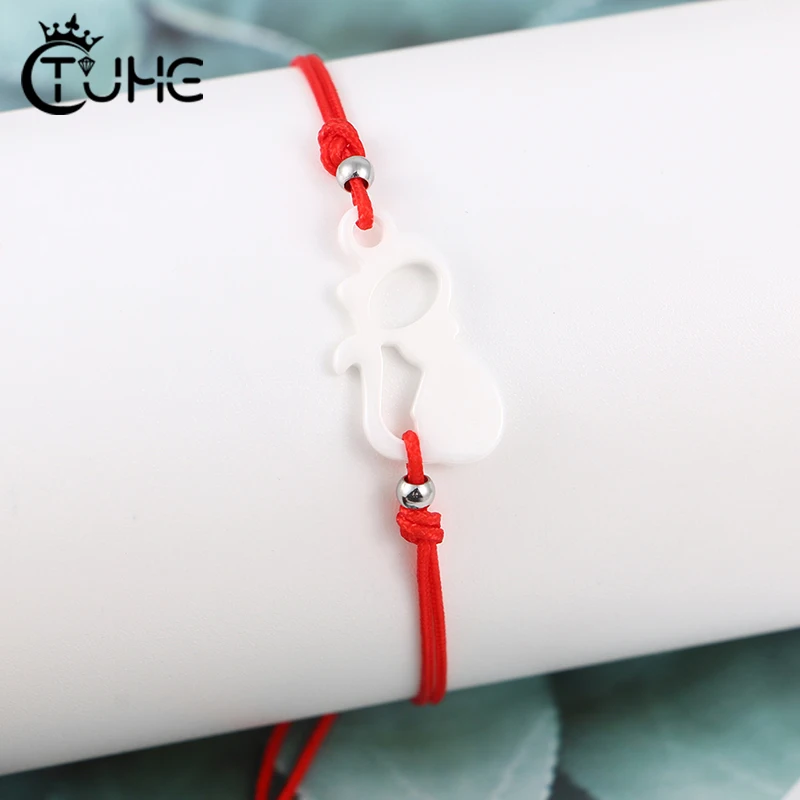 Браслет ручной работы из разноцветной веревки с котом на удачу регулируемый