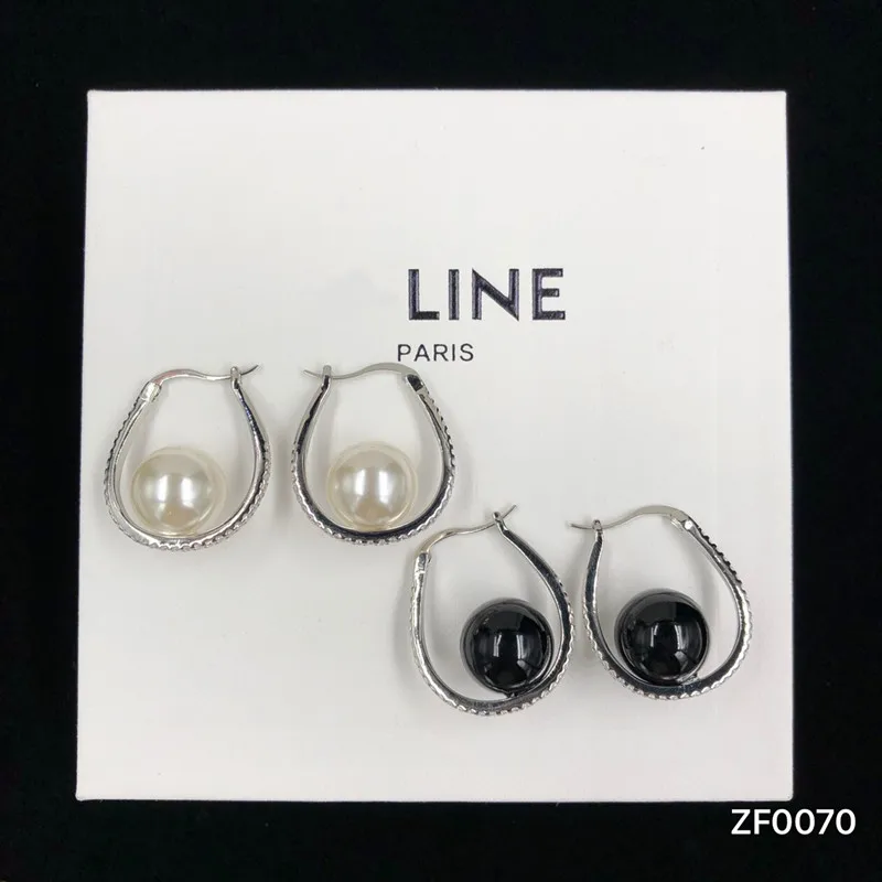 

New fashion personality black and white pearl earrings
