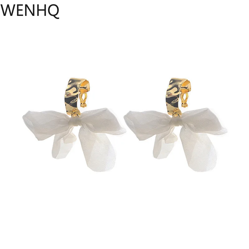 

WENHQ Korea Style White Bow-knot Hoop Earrings for Girl Fashion Gold Color C Shape Clip on Earrings Silicone Pad Cuff Earrings
