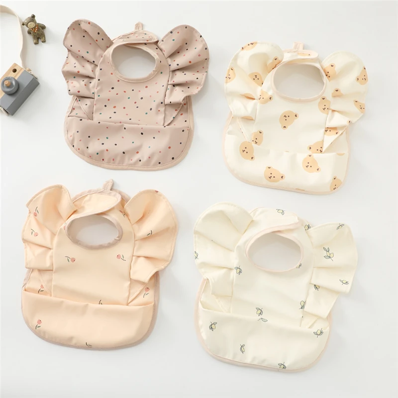 

Baby Food Bag With Angel Wings PU Waterproof Bib Children's Food Supplement Anti-dirty And Saliva Pocket Baberos Bebé Baby Bibs