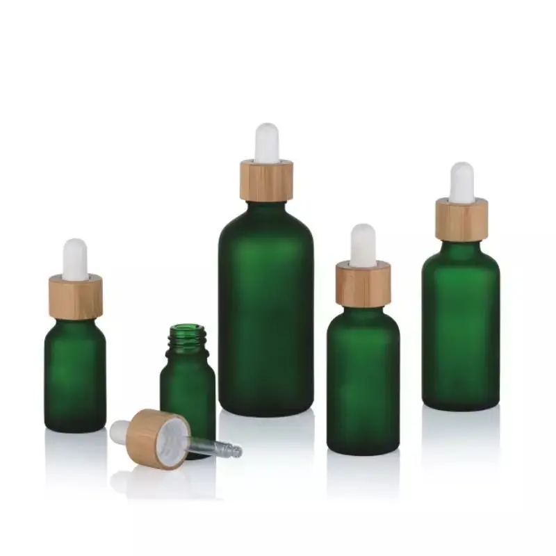 

Wholesale Color Glass Bottles For Skin Care Essential Oil Dropper Bottle With Bamboo Dropper Lid Cosmetic Packaging