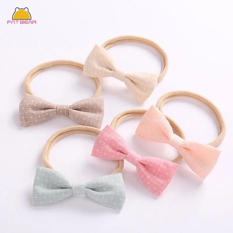 Детская повязка на голову с милым бантом однотонная эластичная нейлоновая для