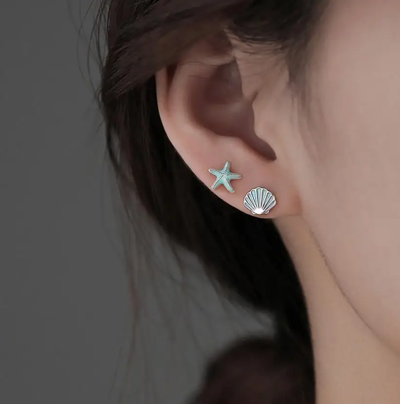 

Серьги-гвоздики женские серебряные Асимметричные в виде ракушек