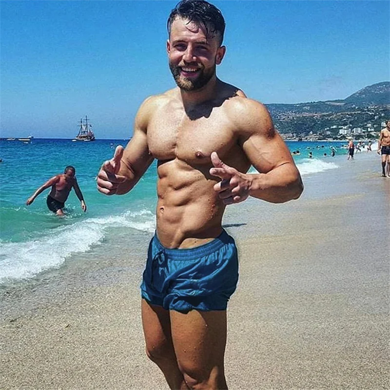 

Men's Summer New Sports Shorts Muscle Fitness Running Training Leisure Loose Breathable Quick-Drying Large Size Beach Pants