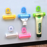 2pcs plastic rolling tube squeezer toothpaste dispenser sucker holder tube hanging holder bathroom toothpaste squeezing tool