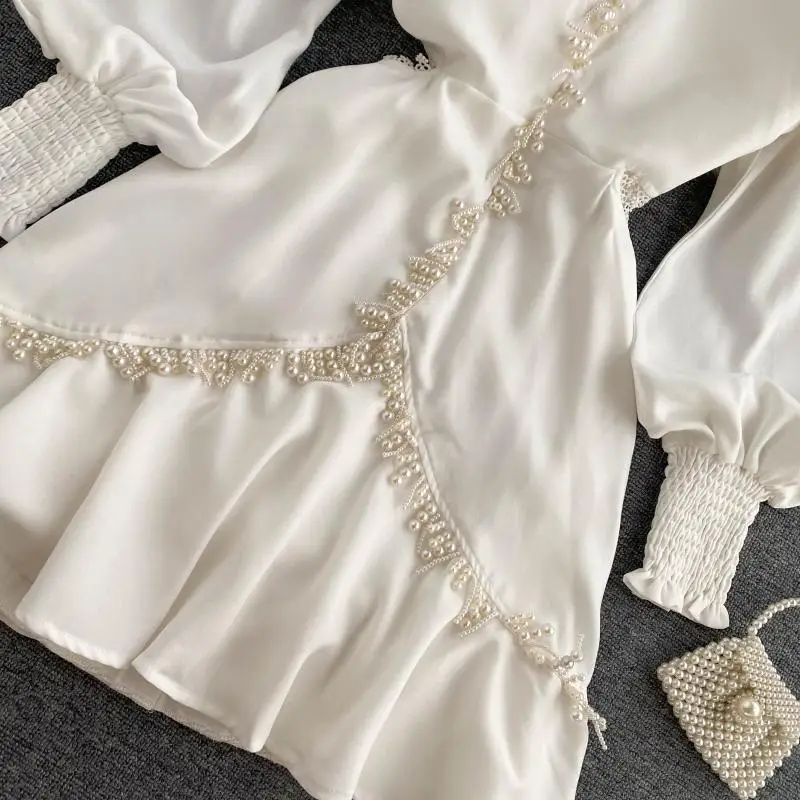 

2020 autumn new dress V-neck celebrity sexy waist lady wind heavy industry French tassel Fairy Dress