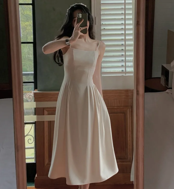 

French temperament condole dress female summer 2021 new white Hepburn wind a long shoulder skirt