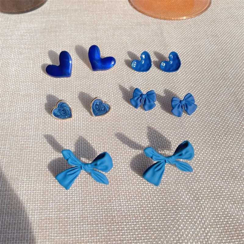 

Minar Retro Blue Colour Enamel Spray Cross Knotted Dangle Earrings for Women Ladies Alloy Small Love Heart Earrings Jewelry