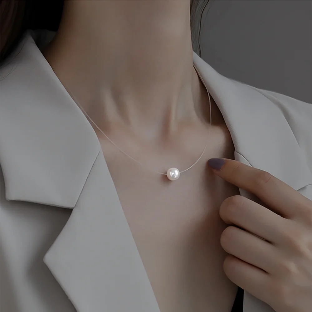 Женский чокер из прозрачной лески с кулоном фианита |