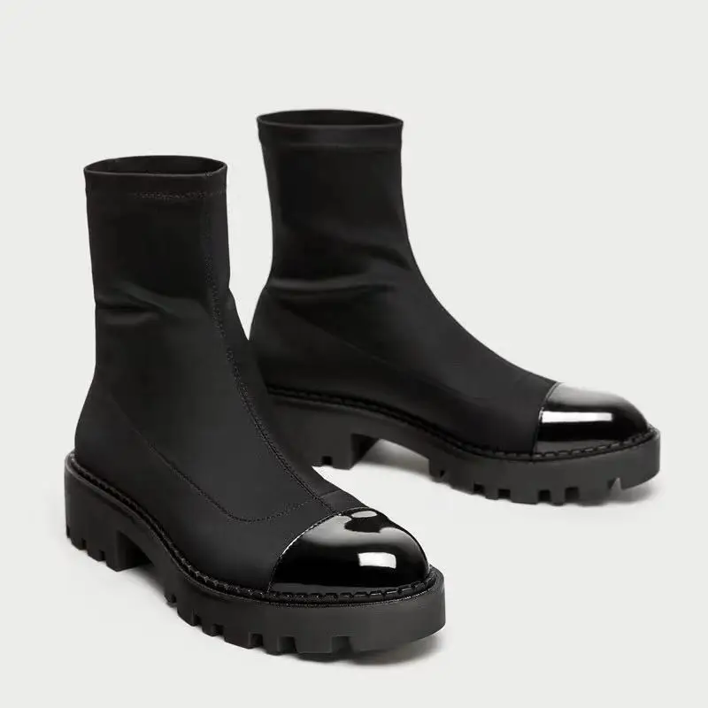 

Новинка 2021, зимние короткие ботинки для женщин, эластичные черные ботинки мартинсы на плоской подошве с круглым носком и толстой подошвой и...