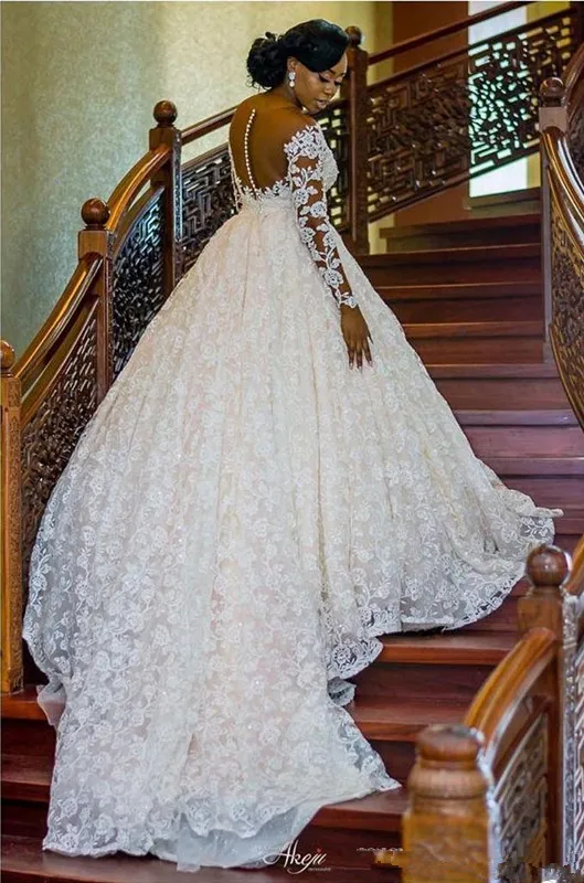 

Plus Size African Wedding Dresses 2020 Arabic Luxurious Lace Beaded Sheer Neck Illusion Long Sleeve Church Garden Bride Wedding