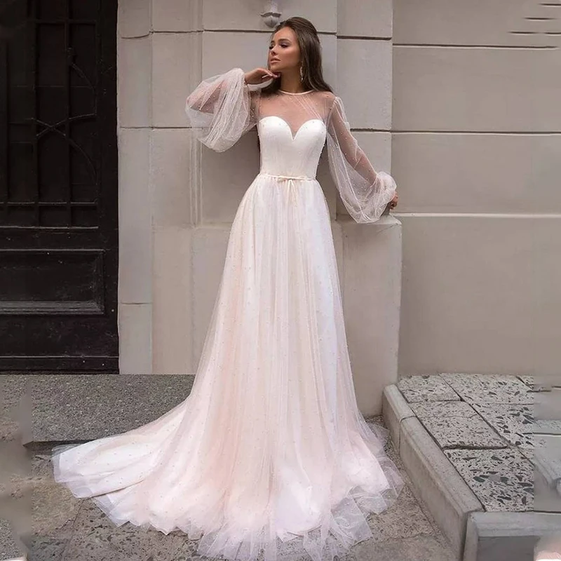 

Charming Full Pearls A Line Wedding Dresses 2022 Tulle Sexy Sheer High Neck Long Sleeves Floor Length Open Back Bridal Gowns